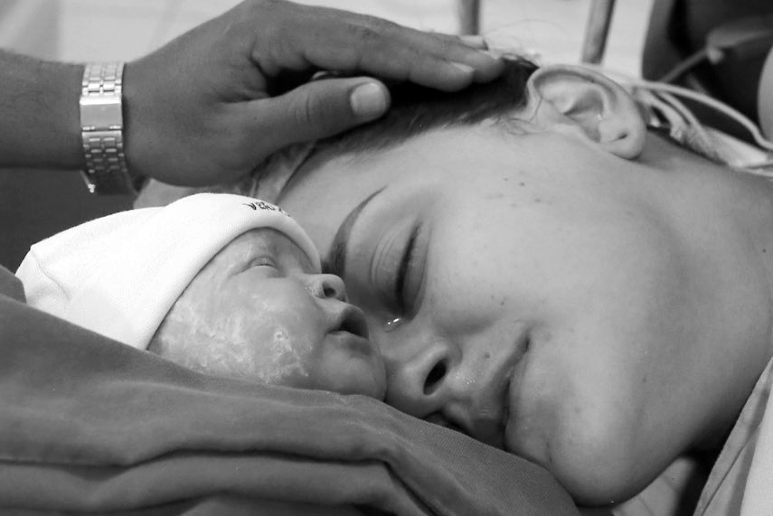 Woman with newborn baby