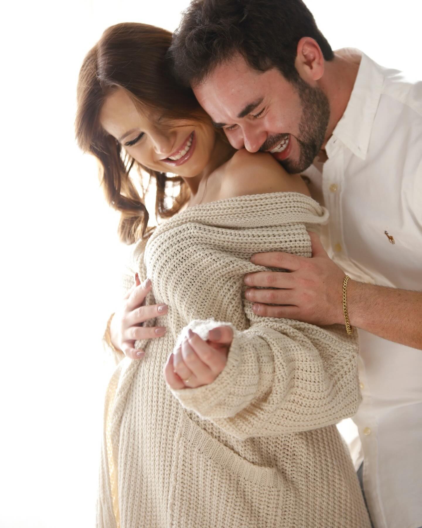Artistic photograph of pregnant woman with partner