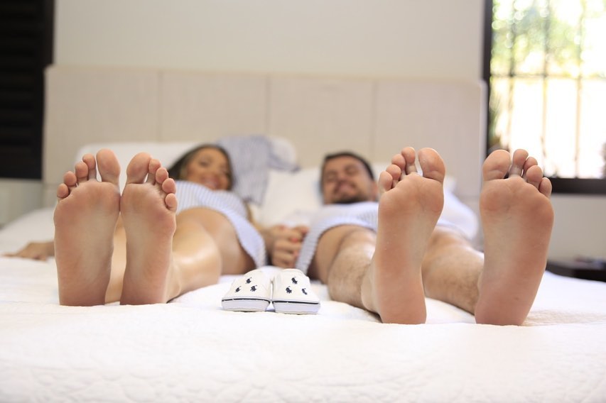Artistic photograph of pregnant woman with partner