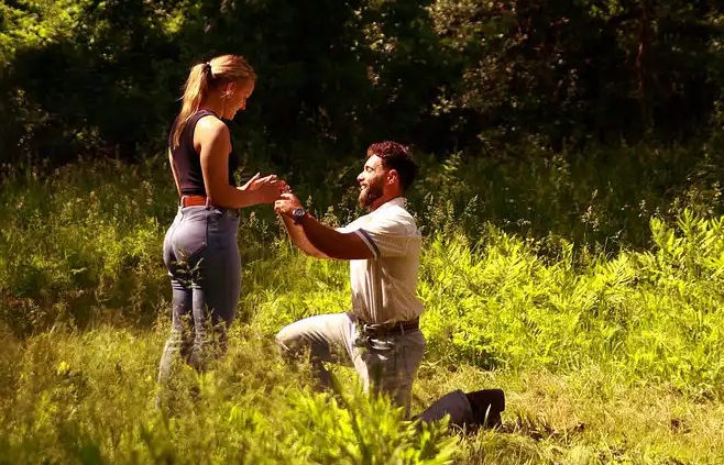 Surprise Engagement Proposal outside with horses